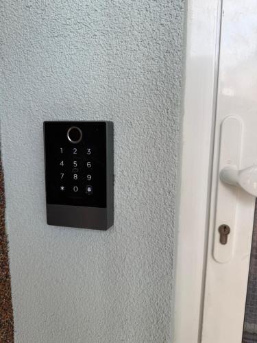 a control panel on a wall with a door at Penzión Siroň in Detva