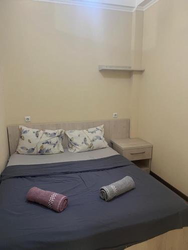 Postel nebo postele na pokoji v ubytování Batumi Komakhidze