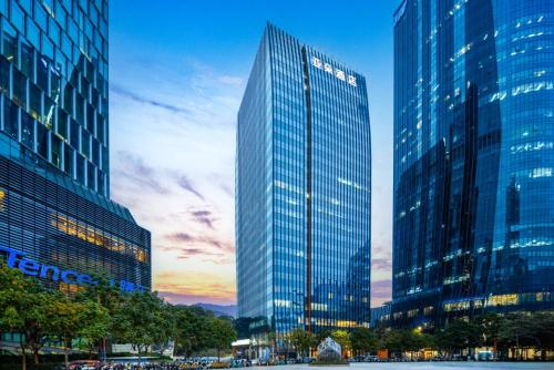 a group of tall buildings in a city at Atour Hotel Shenzhen Nanshan Mango Building in Shenzhen