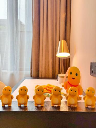 a group of rubber ducks sitting on a table at Atour Hotel Shenzhen Nanshan Mango Building in Shenzhen
