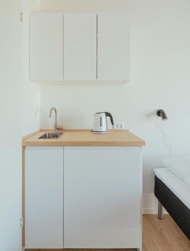 Кухня или мини-кухня в City Center Stay - Rooms & Apartments
