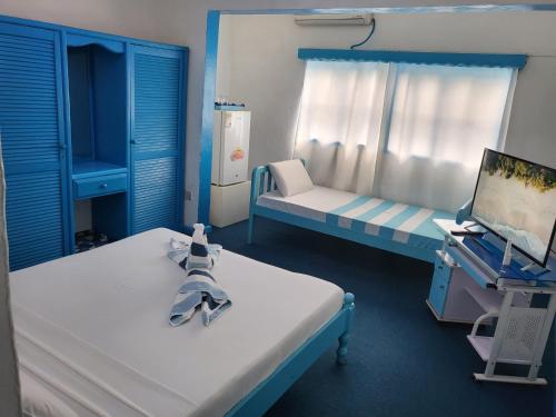 Postel nebo postele na pokoji v ubytování Le Chateau Bleu