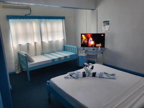 Postel nebo postele na pokoji v ubytování Le Chateau Bleu