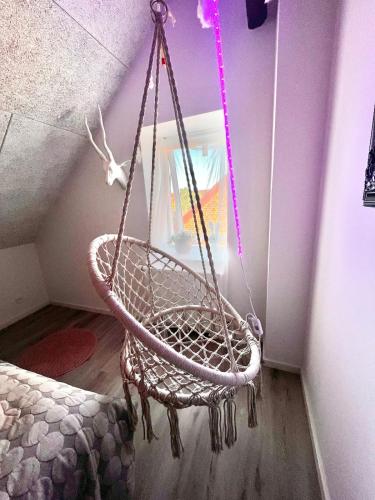 a rope swing hanging from a ceiling in a room at Dalgade loft and living in Vejle