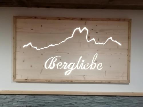 a sign that says excellence with a graph on a wall at Haus Bergliebe in Filzmoos