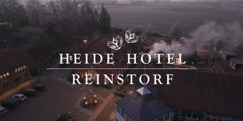 a sign that reads hotel hotel reinforcer on top of a building at Heide Hotel Reinstorf in Reinstorf