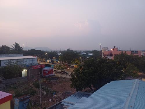 a view of a city from the roof of a building at Kamal Rooms in Tiruvannāmalai