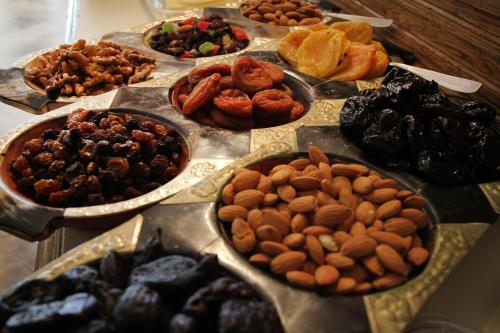 a table topped with plates of different types of food at La Campiña Club Hotel & Spa in Santa Rosa