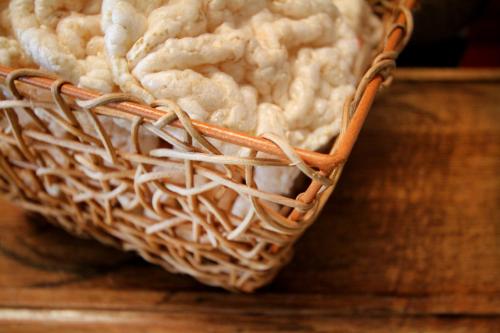 a basket of cauliflower sitting on a wooden table at La Campiña Club Hotel & Spa in Santa Rosa