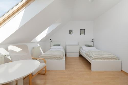 Letto o letti in una camera di Willa Janiska - by Jantar Apartamenty Kołobrzeg