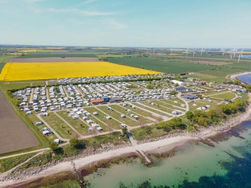 an aerial view of a parking lot next to the water at TiBu - Mietwohnwagen Fehmarn in Fehmarn