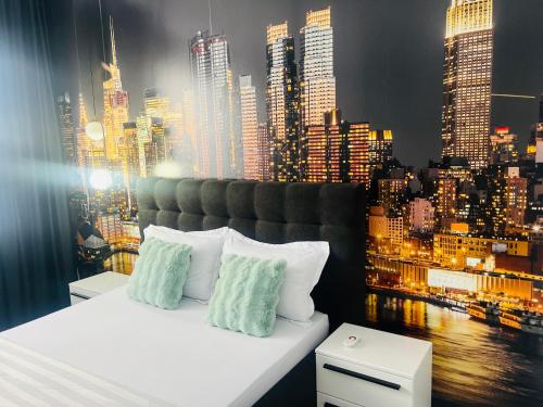 Posteľ alebo postele v izbe v ubytovaní The Garden Apartment