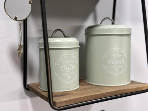 a couple of white candles sitting on a shelf at Vistas by Cardi Suites in Panticosa