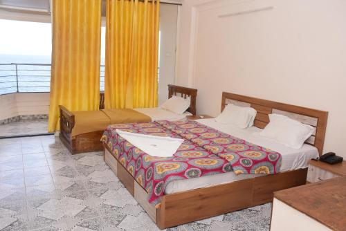 Postel nebo postele na pokoji v ubytování Shorelux Beach Resort