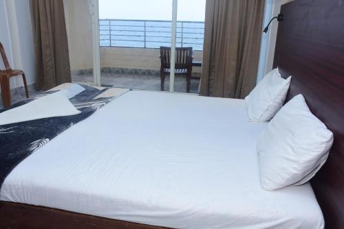 Postel nebo postele na pokoji v ubytování Shorelux Beach Resort