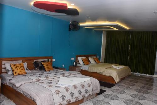 Postel nebo postele na pokoji v ubytování Shorelux Beach Resort
