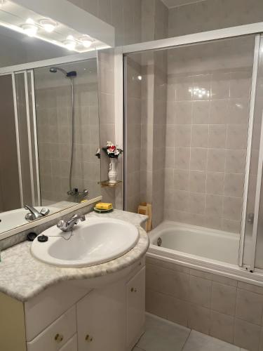 a bathroom with a sink and a bath tub at Montes de Alhama Il in Soria