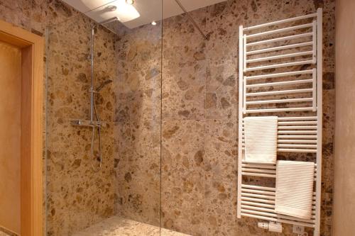 a bathroom with a shower with a glass door at Apartment MarLen in Eben am Achensee