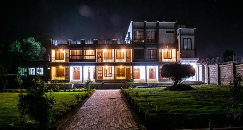 a large house at night with lights on at wonderland Destinations Resort, Naivasha in Naivasha