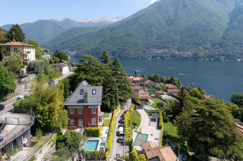 a town with a lake and mountains in the background at Ruby Como Villa with Lake View By Petra Luxury in Laglio