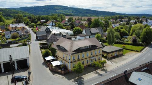 an aerial view of a small town with a building at Historisches Erbgericht Neukirch Lausitz in Niederneukirch