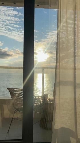 a view of the ocean from a room with a window at Sea View Dream Apartment in BambooBeach Tsikhisdziri in Tsikhisdziri
