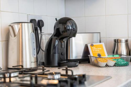 a coffee maker sitting on top of a kitchen counter at 2 Bed House ,Close to Bromley South Station , Free Parking in Bromley