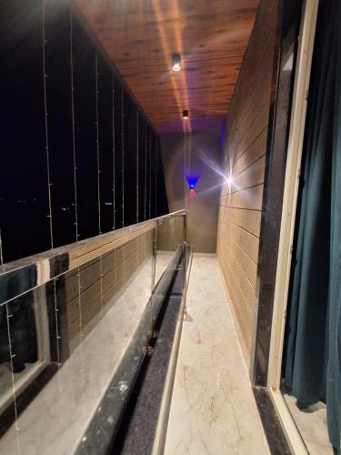 a bowling alley with a bench in a room at Hotel Aries Pushkar in Pushkar