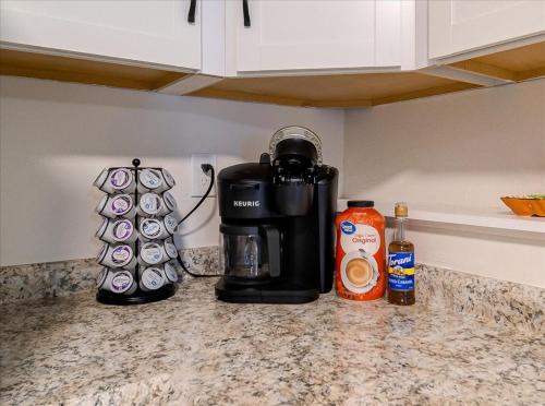 a coffee maker on a counter in a kitchen at Catskills Lakefront with Hot Tub, Sauna and Theater in Monticello