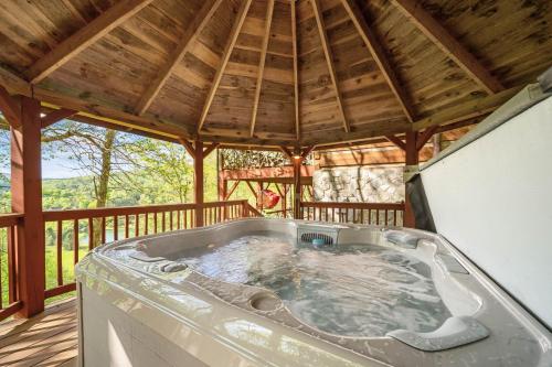 a hot tub in a gazebo on a deck at St Johns Ridge in Sugar Grove
