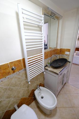 a bathroom with a toilet and a sink at La casa di sotto by PortofinoVacanze in Camogli