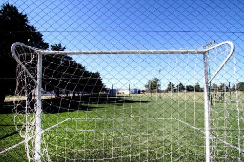 a soccer goal with a field in the background at La Campiña Club Hotel & Spa in Santa Rosa