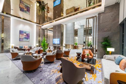 a lobby of a hotel with couches and chairs at Braira Abha Hotel فندق بريرا أبها in Abha