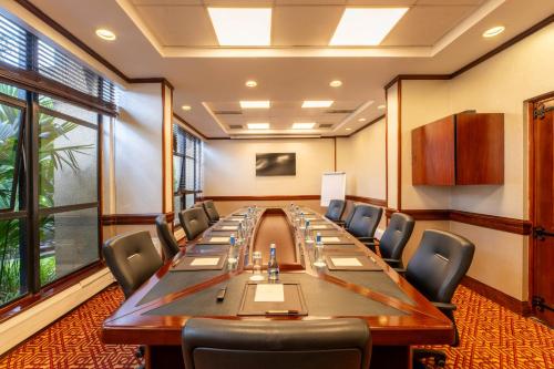 a large conference room with a long table and chairs at Kigali Serena Hotel in Kigali
