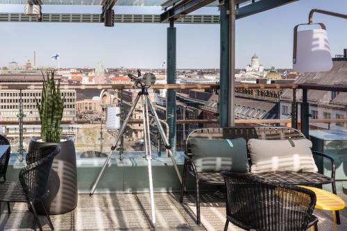 a camera on a balcony with a view of a city at Scandic Simonkenttä in Helsinki