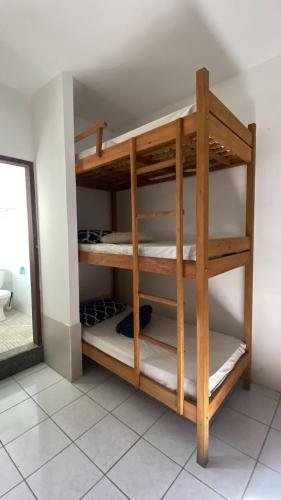 a room with bunk beds in a room at Hostel ABC in Angra dos Reis