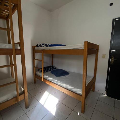 a group of bunk beds in a room at Hostel ABC in Angra dos Reis