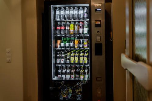 a vending machine filled with lots of soda bottles at Johannes Schlössl - Gästehaus der Pallottiner am Mönchsberg in Salzburg