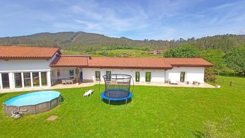 an image of a yard with a house at Casa Rural Txokoetxe in Mungia