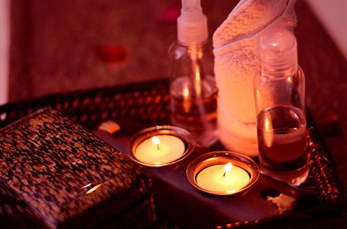 a group of candles and bottles on a table at Thunderbird Resorts - Rizal in Binangonan