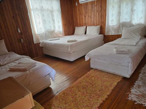 Кровать или кровати в номере Korsan Pension