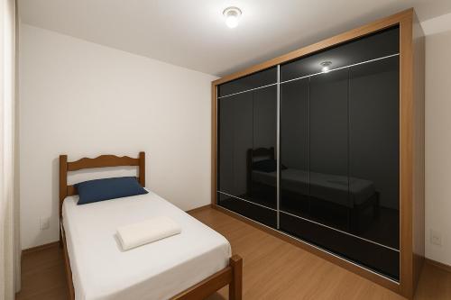 Ένα ή περισσότερα κρεβάτια σε δωμάτιο στο Apartamento de 2 Quartos com Piscina e Academia e Garagem Brinquedoteca