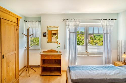 a bedroom with a bed and a window at Ferienwohnung Lavendel Hofgeismar in Hofgeismar