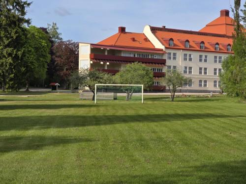 a soccer goal in a field in front of a building at Stora Ekeberg vandrarhem in Axvall