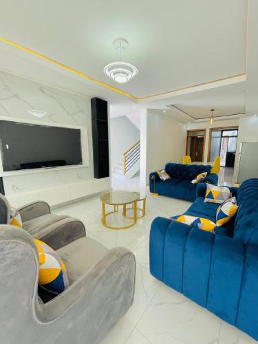 Posezení v ubytování Iwabo Apartments Kigali Airport Kanombe