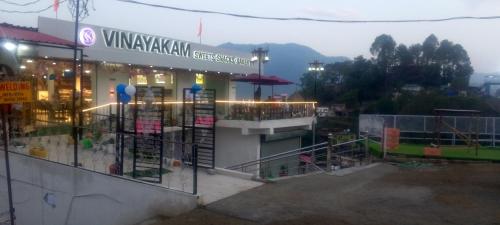 a vijayanandan grocery store with a view of a building at The Grand BalRaj salogra solan in Solan