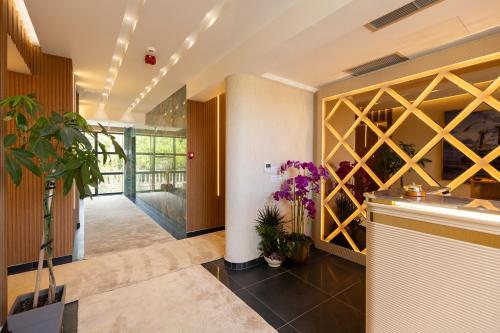 a hallway with a wine cellar in a house at Bora Bora Hotel Ksamil in Ksamil