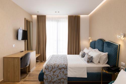 Кровать или кровати в номере Bora Bora Hotel Ksamil