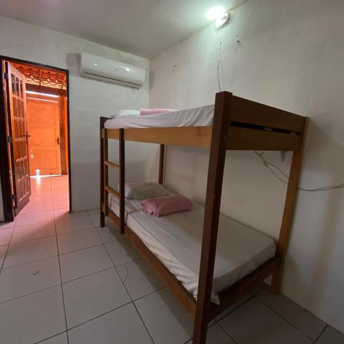 a couple of bunk beds in a room at Hostel ABC in Angra dos Reis
