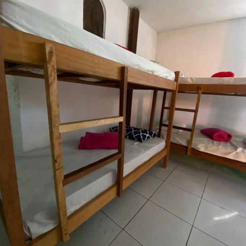 a group of bunk beds in a room at Hostel ABC in Angra dos Reis
